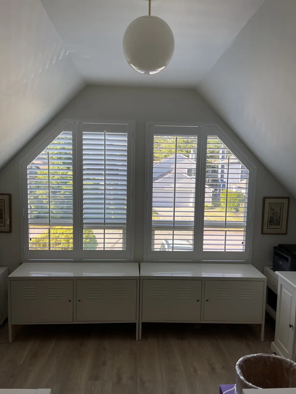 Shutters beneath a sloping ceiling
